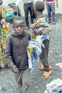 A boy going home after receiving the clothes given by Bsaved organisation in Goma_DRC