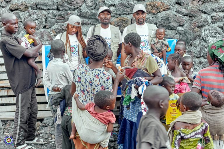 Bsaved team with Mothers in a camp