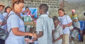 A motivated Besaved team serving the children during the event 3