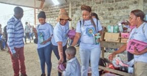 A young child captured recieve the school resources from the charity organization 3