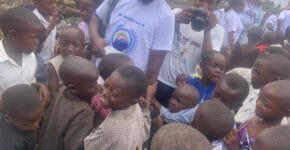 Children gather to recieve clothings from Besaved Charity Organization 3