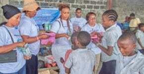 Children recieve books and other scholastic materials 3